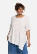 Tunica 'Crissa' – plissettata, leggera e modernamente asimmetrica